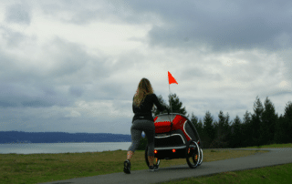 Buy a Jogging Stroller Woman Running with Hamax Outback