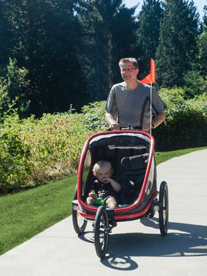 Buy a jogging stroller man running with Hamax Outback