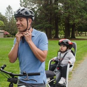 cycling with a child seat using helmets